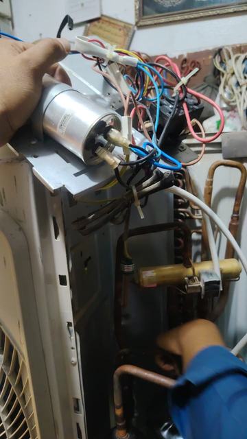 Checking the capacitor and wiring in an outdoor unit
