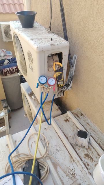 Pressure gauges connected to an outdoor unit